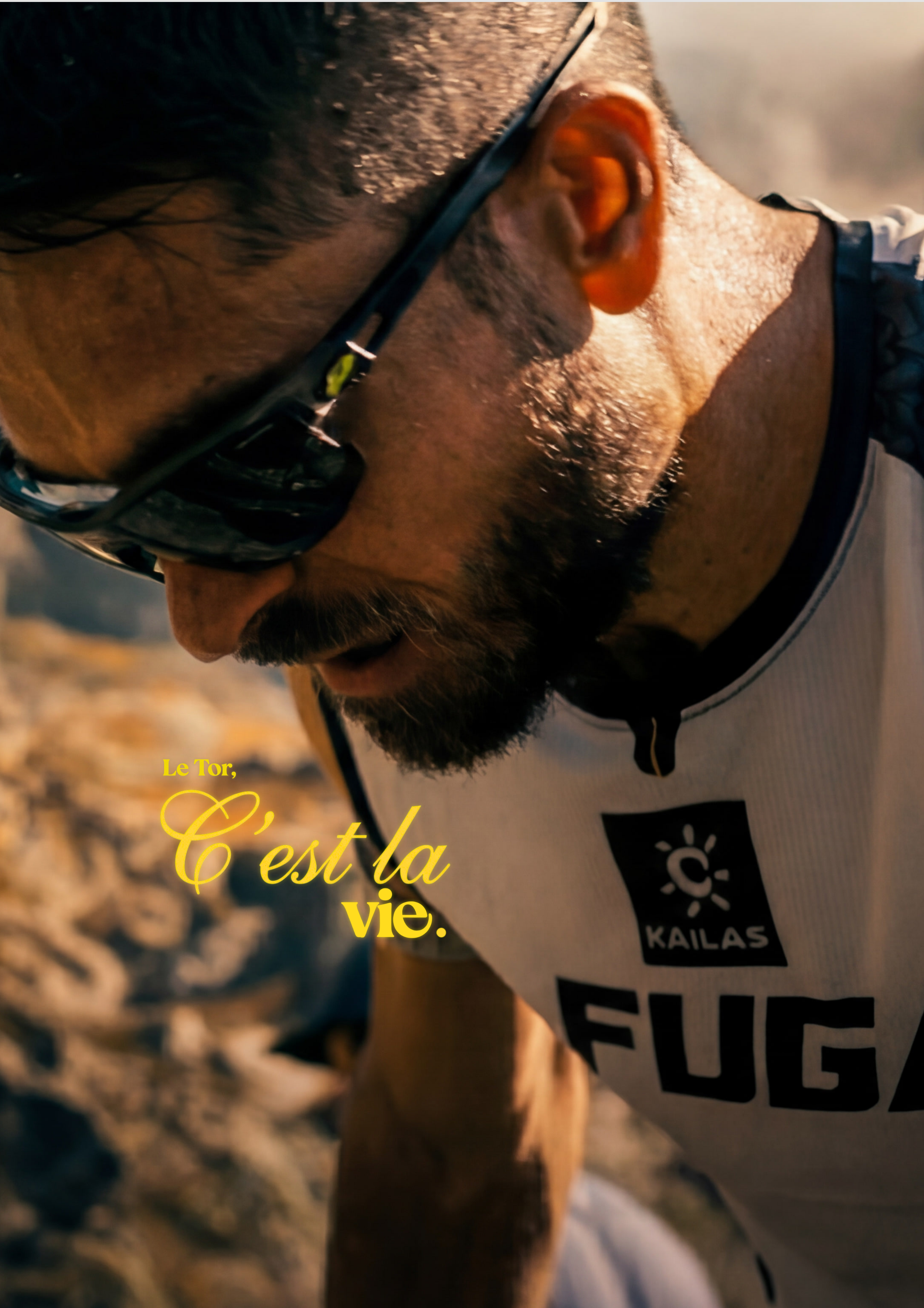 Le Tor — runner in Kailas FUGA jersey, sun-flare close-up